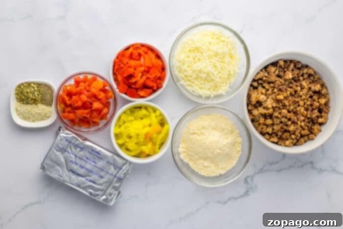 Spicy Rotel Sausage Dip 3 Creamy Hot Sausage Dip served in a white baking dish