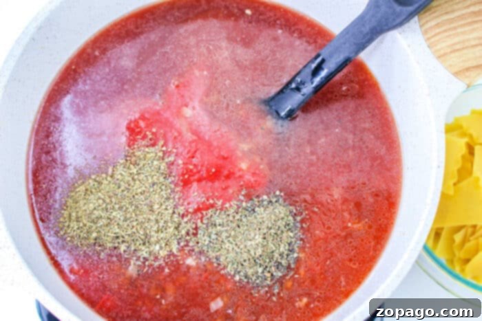 Easy One Pot Lasagna Soup 5 Dutch Oven Lasagna Soup with melted cheese and fresh basil