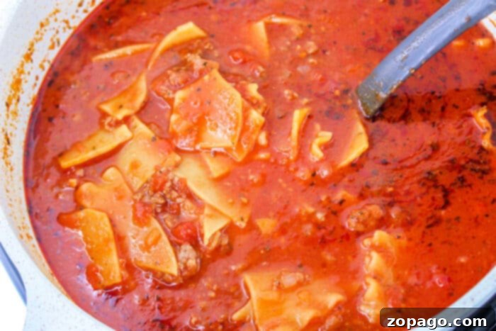 Easy One Pot Lasagna Soup 6 Lasagna Soup on Stove simmering in a large pot