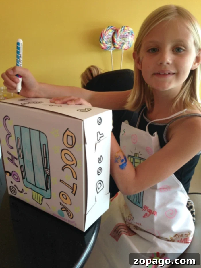 Child decorating a cake box, part of cheap girl birthday party ideas
