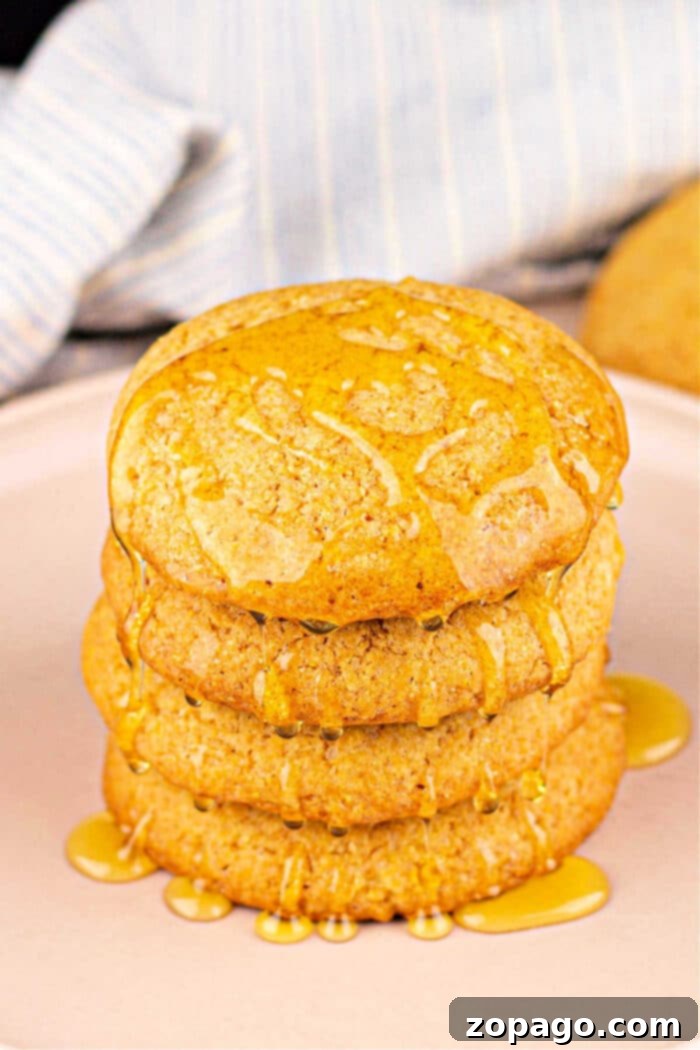Golden Cornbread Cookies 8 Stacked cornbread cookies with honey drizzle