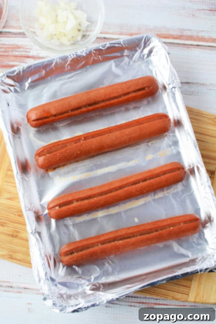 Perfect Oven Baked Hot Dogs 6 How do You Make Hot Dogs in the Oven: Close-up of baked hot dogs in buns with condiments