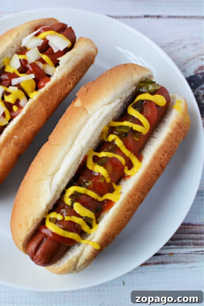 Perfect Oven Baked Hot Dogs 7 Wieners in the Oven: a close-up of beautifully browned hot dogs in buns, ready to eat