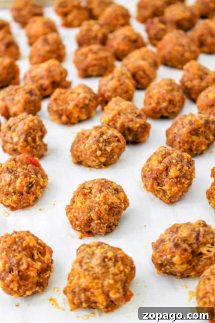 Taco Poppers 4 Oven baked taco balls resting on a parchment-lined baking sheet