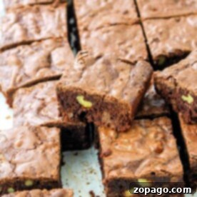 Decadent 100 Hour Brownies, rich with chocolate chips and cut into perfect squares