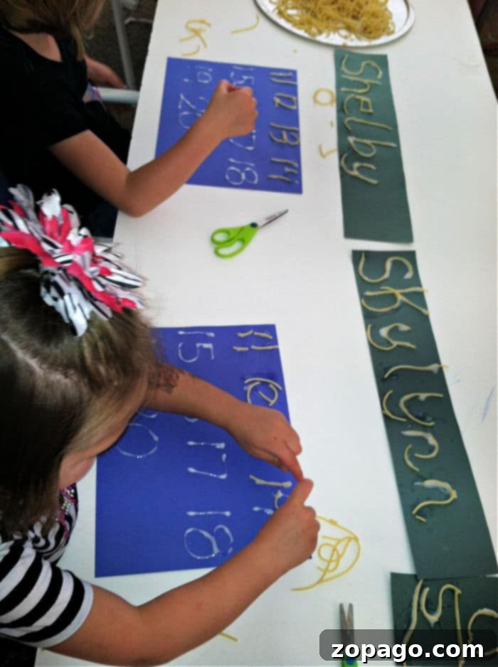 Fun Letter Crafts to Boost Early Literacy Skills Child proudly displaying a craft project forming letters with colorful noodles.