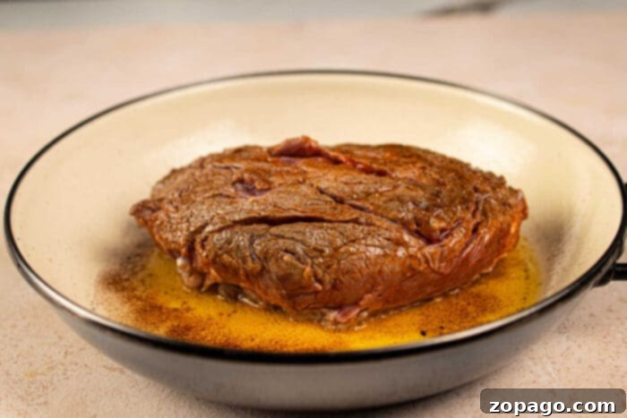 Chuck Roll Steak
A Cut Above: The Chuck Roll Steak Experience 3 A seared chuck roll steak in a pan with sizzling juices and beautifully browned edges.