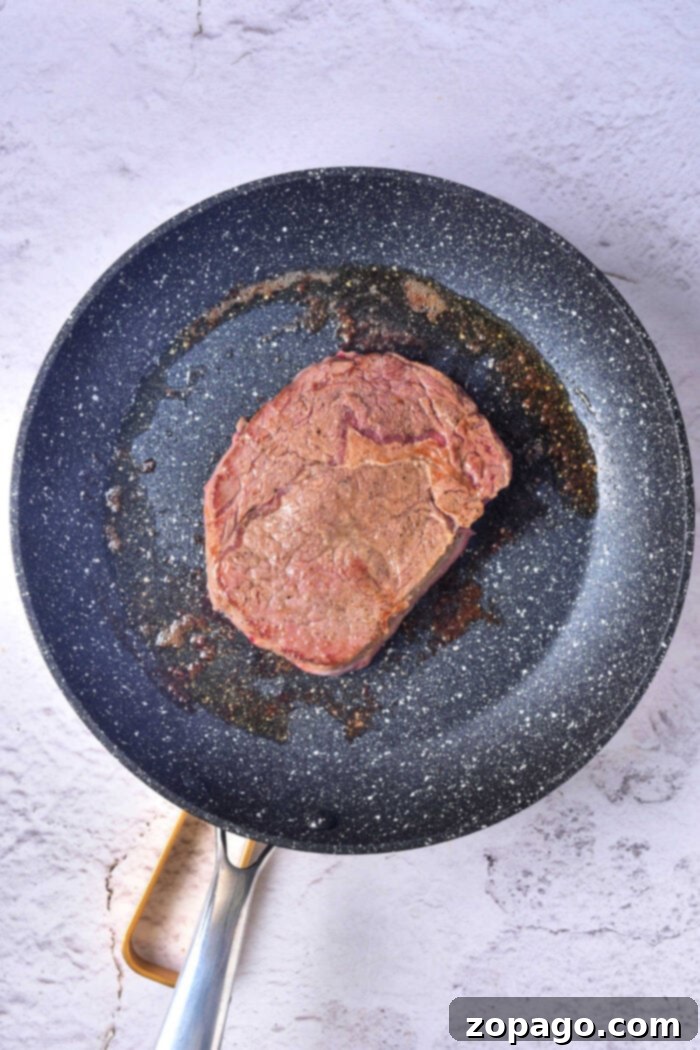 Velvet Oven Steak 3 Expert tips for pan frying steak to create a perfect crust before oven baking for a tender interior.