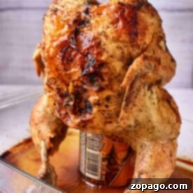 Oven-Baked Beer Can Chicken 6 Beer Can Chicken in oven, perfectly roasted on a can in a glass baking dish.