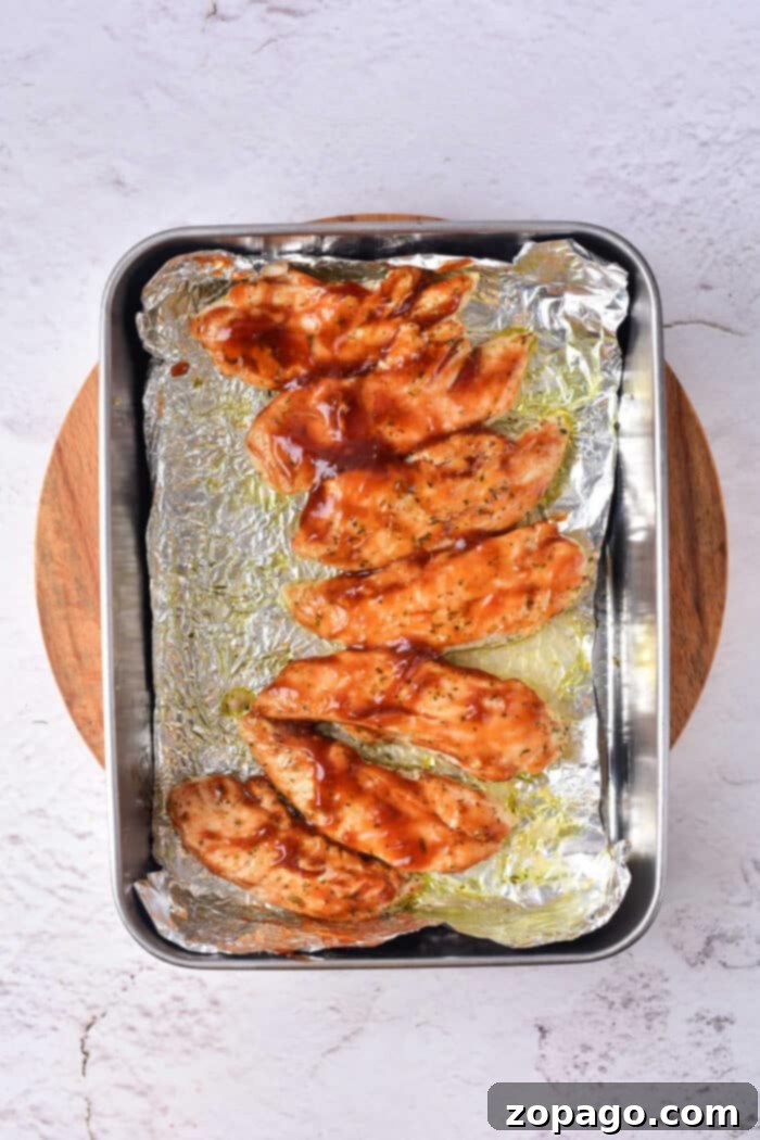 Naked Oven Chicken Tenders 6 Crispy oven-fried chicken tenders arranged on a wire rack over a baking sheet