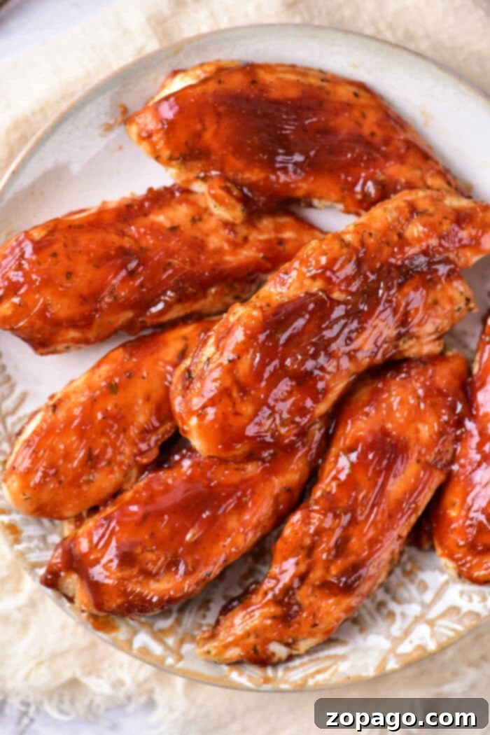 Naked Oven Chicken Tenders 7 Freshly reheated chicken tenders, golden and inviting, ready to be enjoyed as a quick meal or snack.
