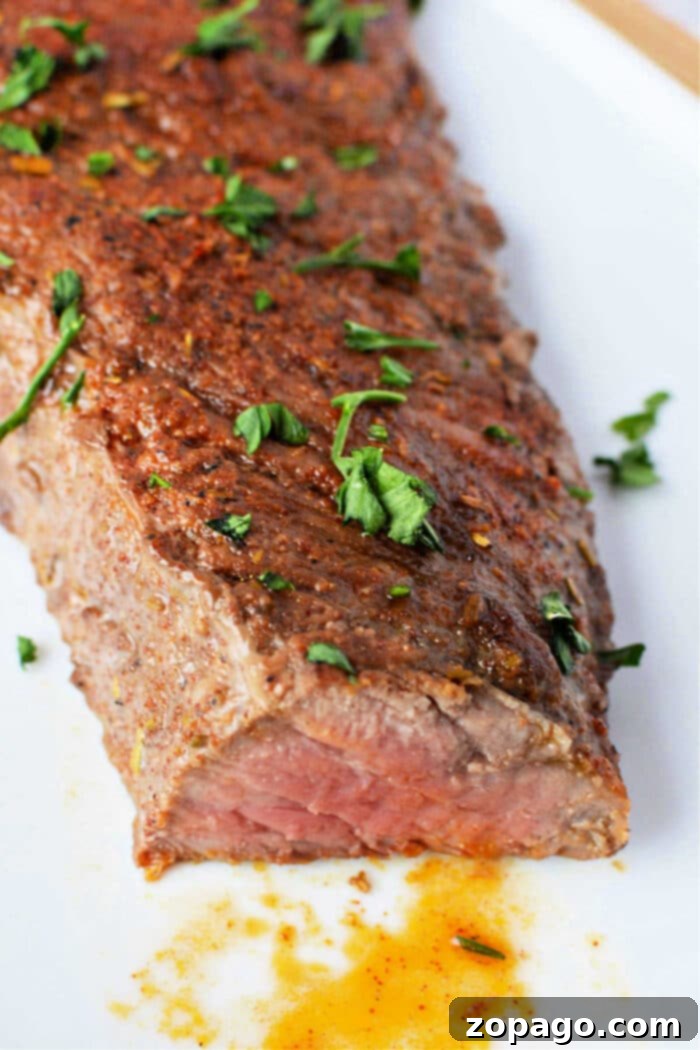 Perfect Oven Roasted Tri Tip 2 How to Cook Tri Tip in Oven - A perfectly cooked, medium-rare tri-tip roast, sliced and ready to serve.