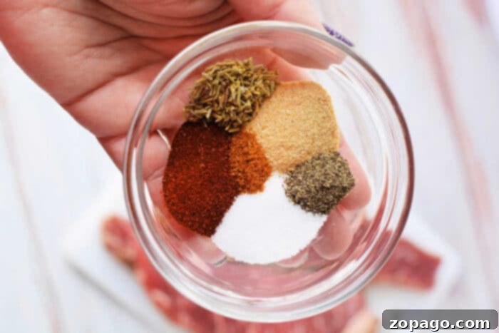 Perfect Oven Roasted Tri Tip 4 An array of spices, including paprika, salt, garlic powder, rosemary, pepper, and cayenne, ready to create a delicious tri-tip dry rub.