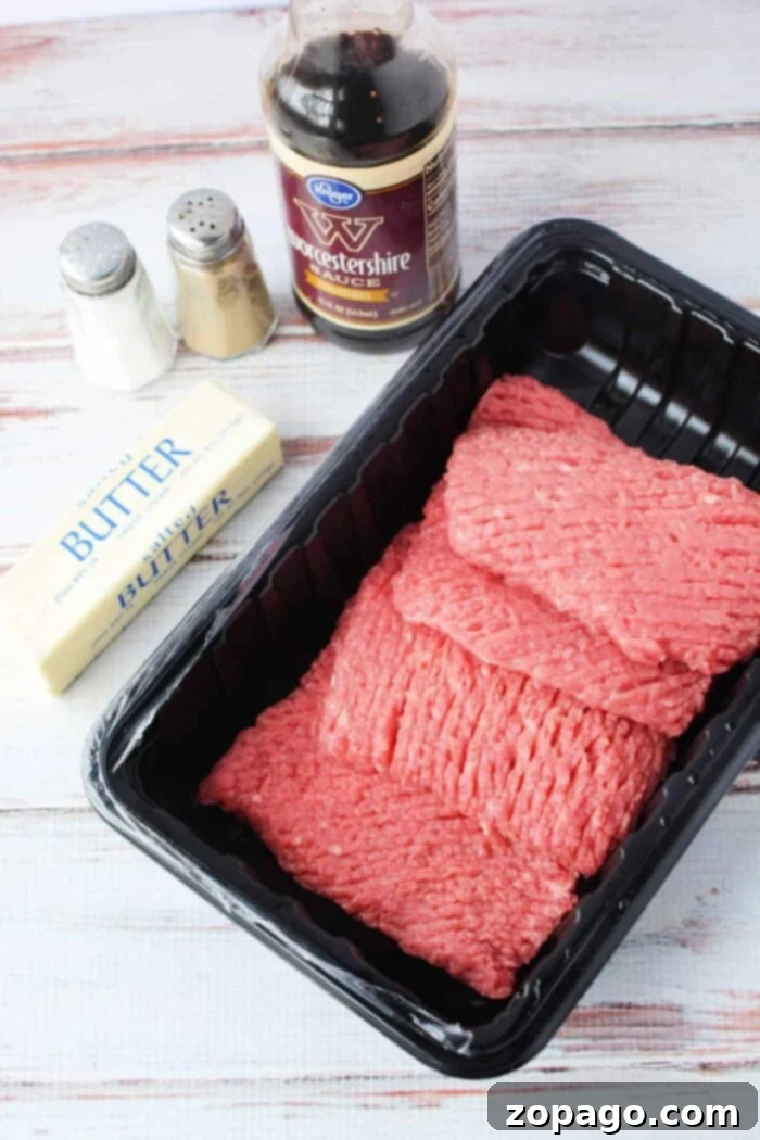 How to Perfectly Pan-Fry Cube Steak 3 Ingredients for a recipe: cubed steak, Worcestershire sauce, butter, salt, and pepper on a white wooden surface. Wondering how long to cook cube steak in a frying pan?.