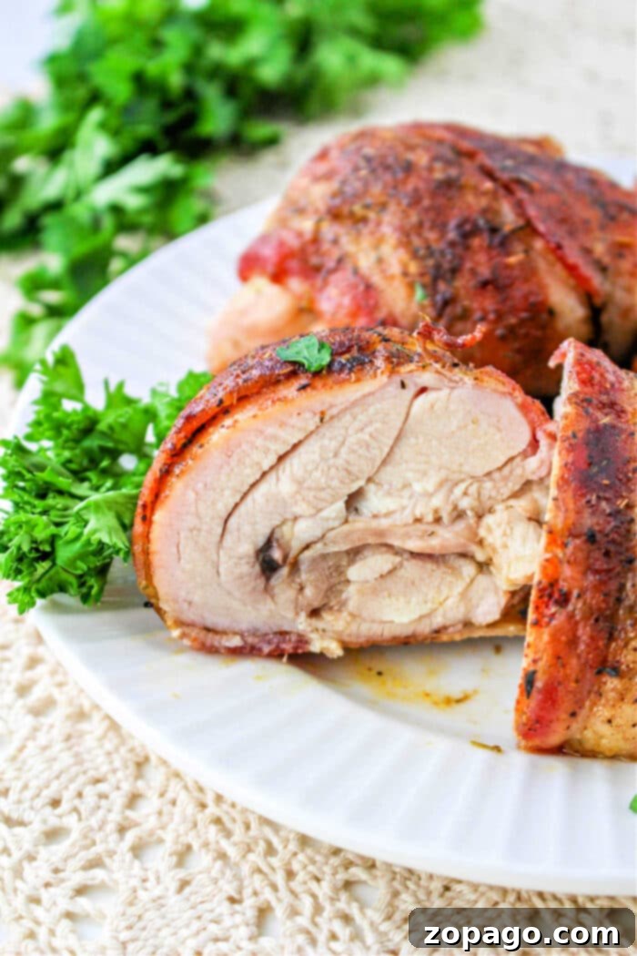 Crispy Bacon Wrapped Chicken Thighs 2 Bacon Wrapped Chicken Thighs perfectly cooked in the oven, golden and crispy.
