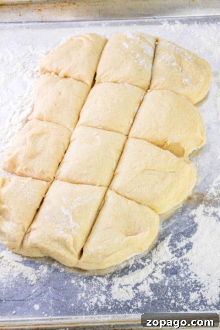 Festive Easter Bunny Buns 6 Divided dough pieces on a floured surface, ready for baking, perfect for crafting your favorite Bunny Bread recipe.