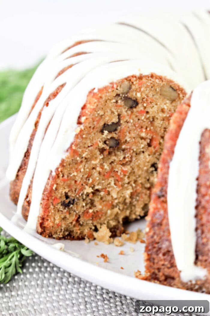 Moist Carrot Loaf Cake 8 A beautifully frosted slice of carrot pound cake with nuts