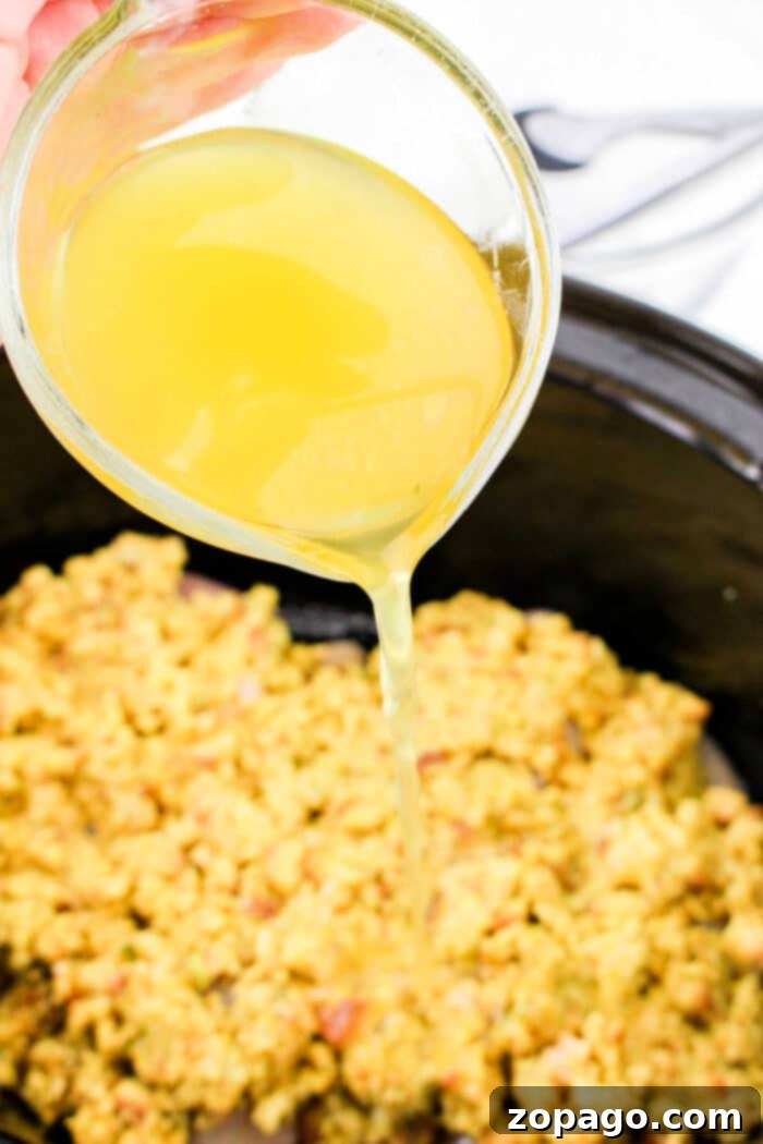 Easy 5-Ingredient Slow Cooker Chicken and Stuffing 6 A close-up shot of the finished slow cooker chicken and stuffing, showcasing its rich texture, steam, and comforting appeal.