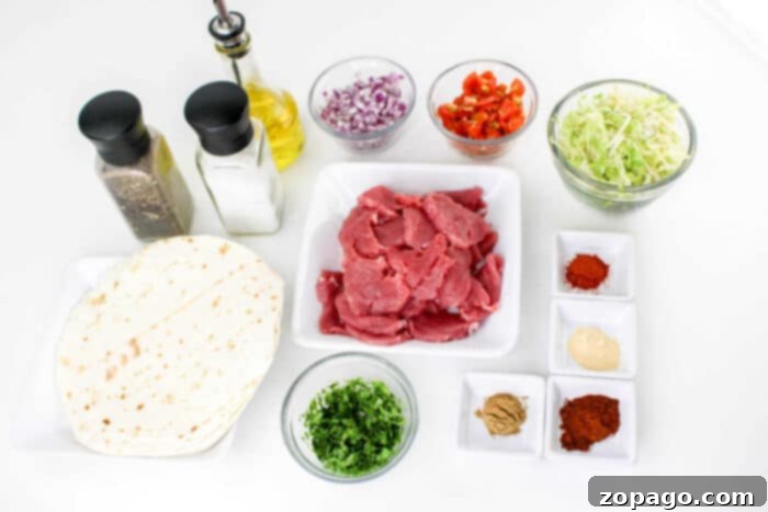Succulent Pork Tenderloin Tacos 4 Ingredients for a meal are arranged on a white surface, including tortillas, raw pork slices, chopped cilantro, shredded cabbage, diced red onions, chopped red peppers, various spices in small dishes for making Pork Tenderloin Tacos, a bottle of olive oil, and salt and pepper shakers.