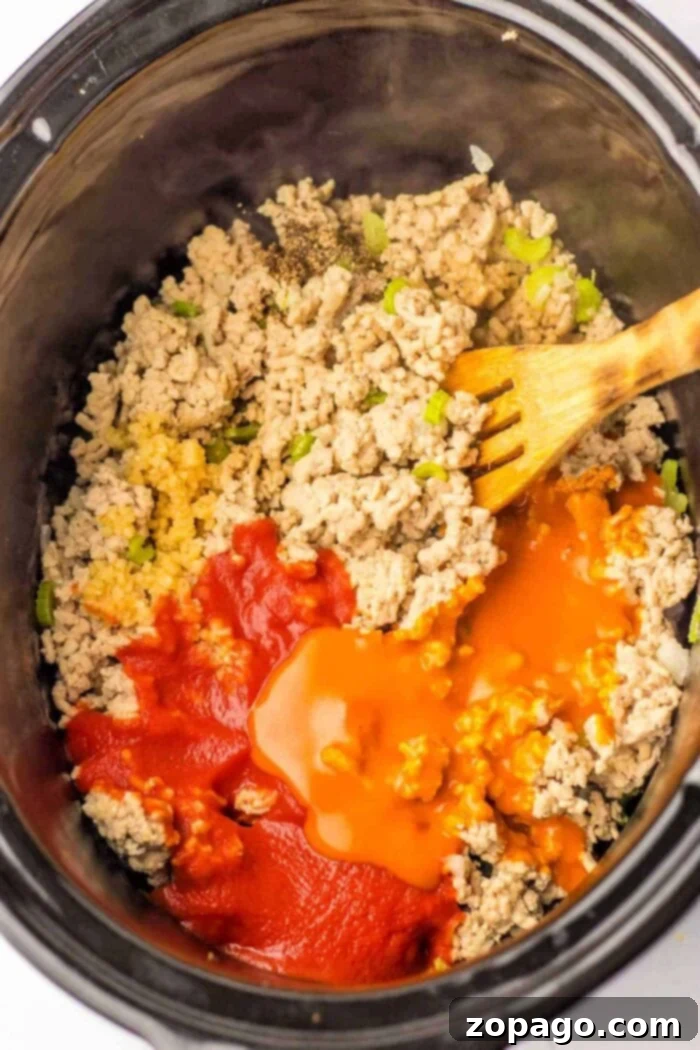 Perfectly Cooked Ground Chicken: A Timing Guide 4 Mix ground chicken, diced peppers, and sauces in a slow cooker with a wooden spoon. For those considering alternatives like ground chicken, be aware of the different cooking times required to ensure the perfect texture and flavor.