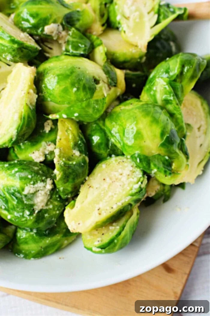 Perfectly Boiled Brussels Sprouts 2 Perfectly boiled Brussels sprouts in a serving dish, ready to be enjoyed or further cooked.