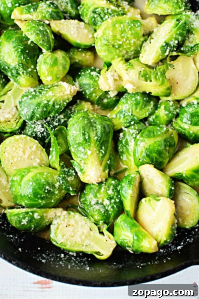 Perfectly Boiled Brussels Sprouts 6 A perfectly cooked plate of Brussels sprouts, illustrating the ideal texture and color achieved by knowing how long to boil them. The image captures the essence of well-prepared Brussels sprouts, ready to be served.