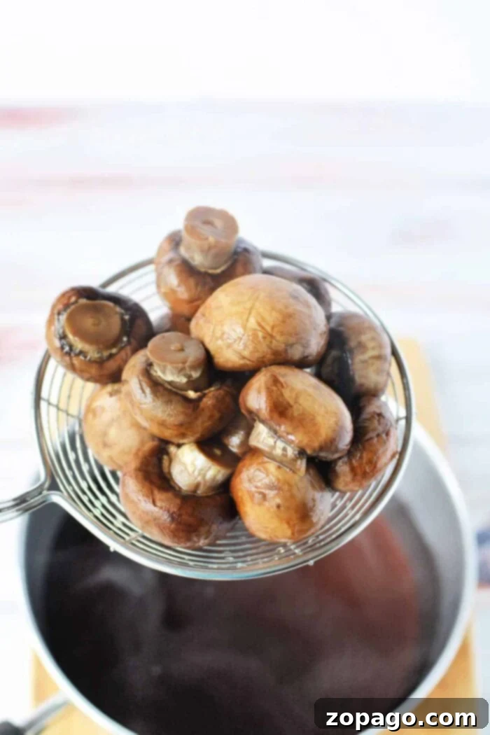 Simmered Mushrooms 8 Boiled portobello mushrooms prepared for a recipe.