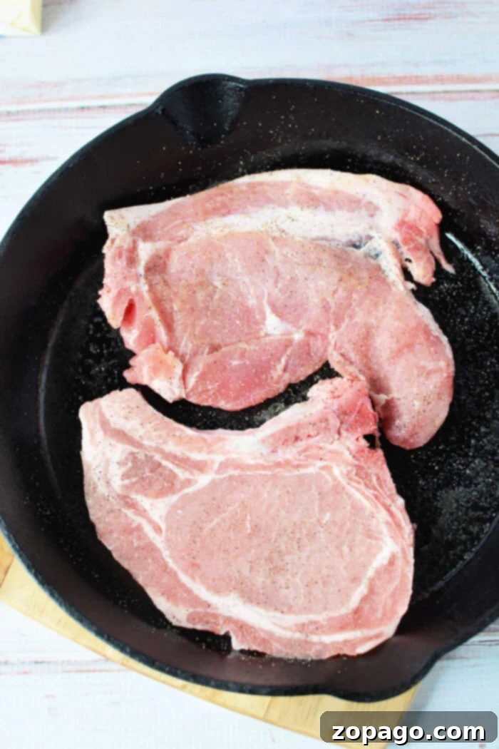 Tender Pork Chops Smothered in Rich Mushroom Gravy 5 Perfectly cooked bone-in pork chops generously covered in a rich, savory gravy.