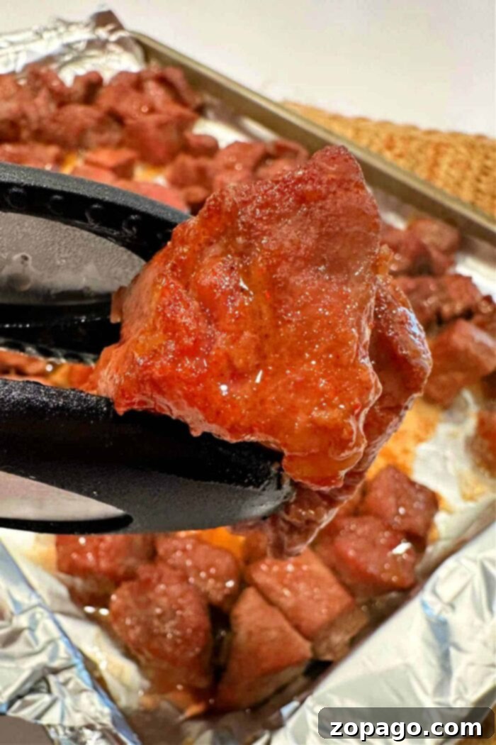 Perfect Oven Baked Steak Tips 6 Oven-baked steak bites resting on a sheet pan