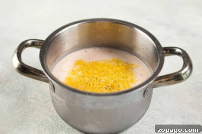 Perfect Homemade Boba for Bubble Tea 5 Tapioca pearls boiling vigorously in a pot on the stove, creating steam