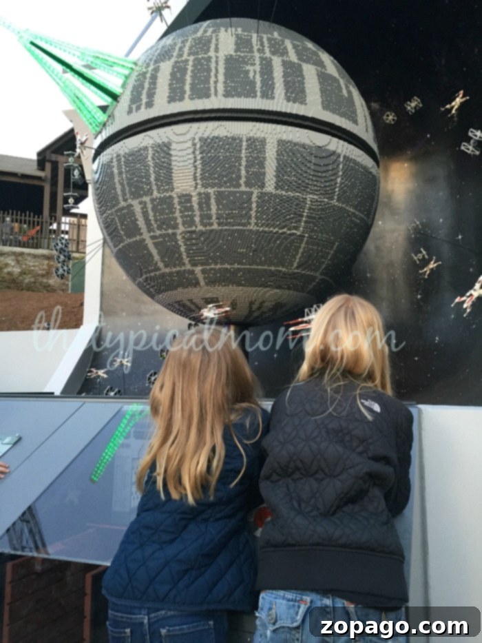 LEGOLAND Star Wars Miniland Interactive Zone Children excitedly playing and building with LEGO bricks in the interactive Star Wars Miniland area at LEGOLAND California.