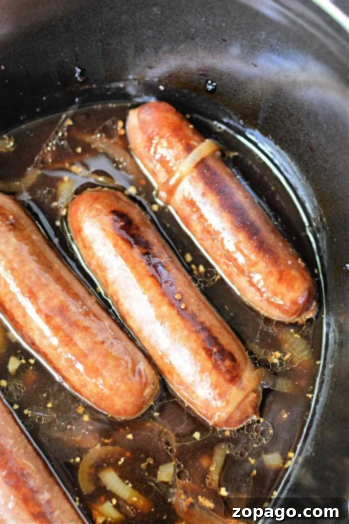 Tender Slow Cooker Bratwurst 2 brats in slow cooker