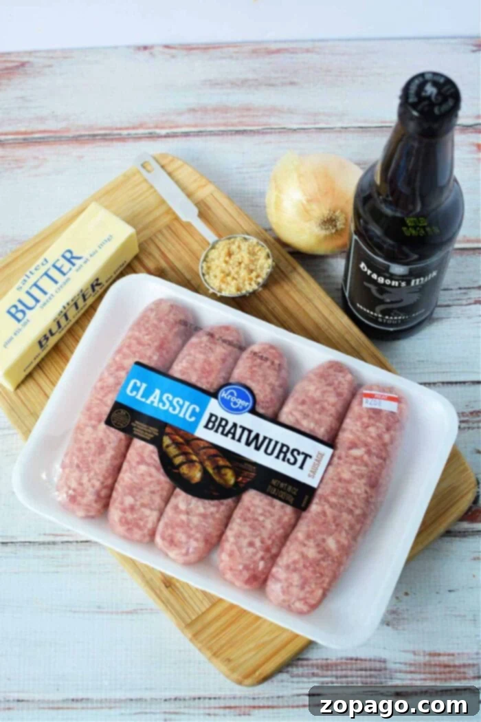 Tender Slow Cooker Bratwurst 3 bratwurst, butter, chopped garlic, onion, and a beer bottle rest on a cutting board—perfect for crafting delicious Crockpot Brats.