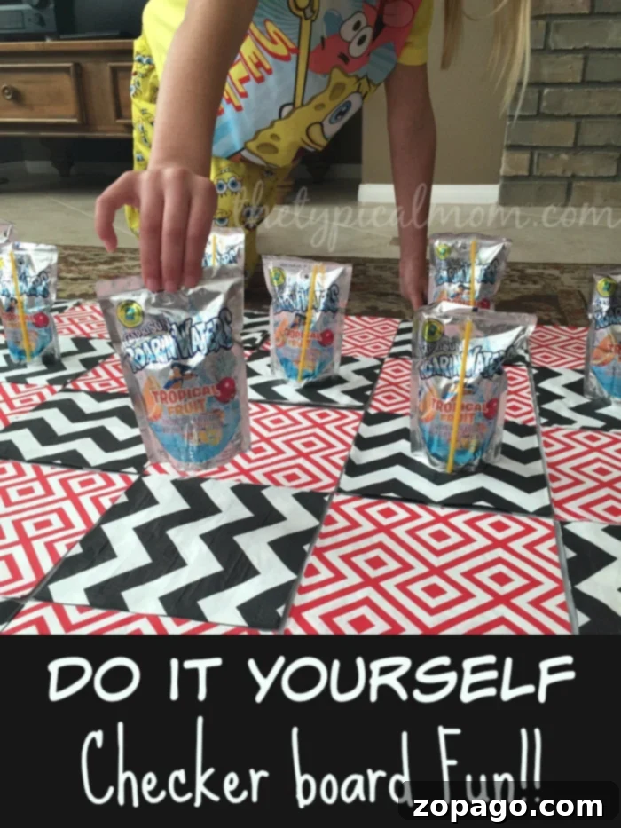 DIY Giant Checkerboard: Engaging Games to Play at Home with Kids Giant checkerboard game made with napkins, a tablecloth, and juice pouches for kids fun at home.