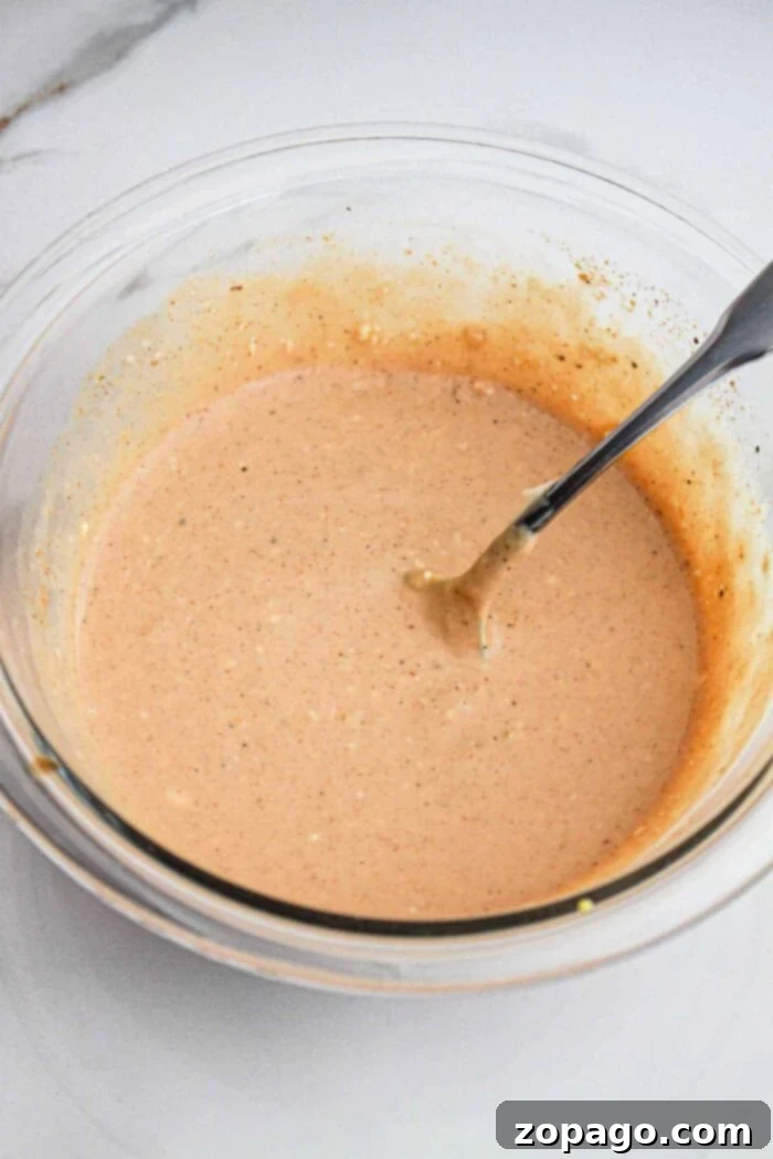 Finger Lickin Sauce Recipe for Chicken - A bowl of sauce with chicken tenders.