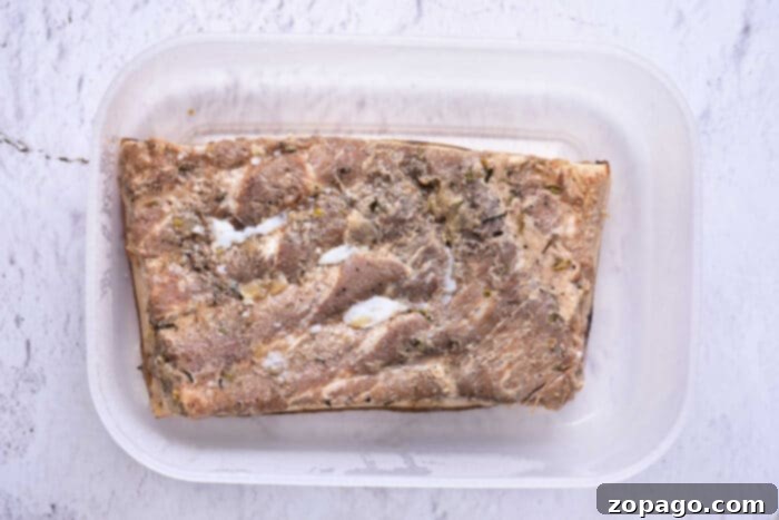 Mastering Pork Belly Confit 6 Confit pork belly, golden brown and glistening, cut into perfect, tender pieces ready to serve.