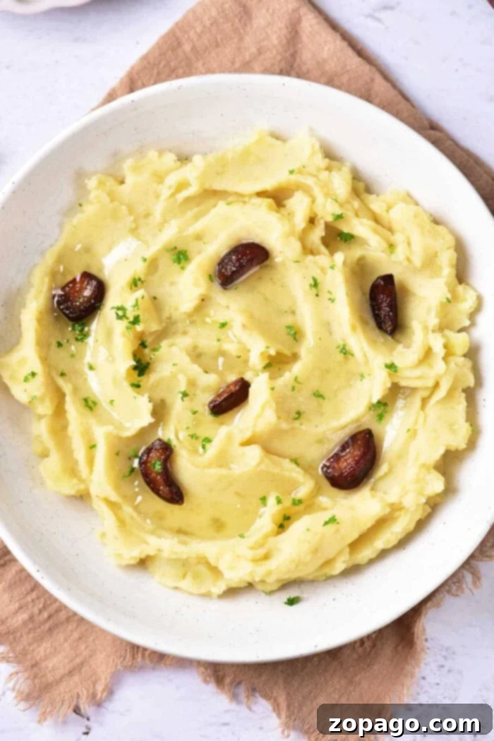 Velvety Garlic Confit Mashed Potatoes 2 Creamy Garlic Confit Mashed Potatoes, a luxurious side dish perfect for holidays.