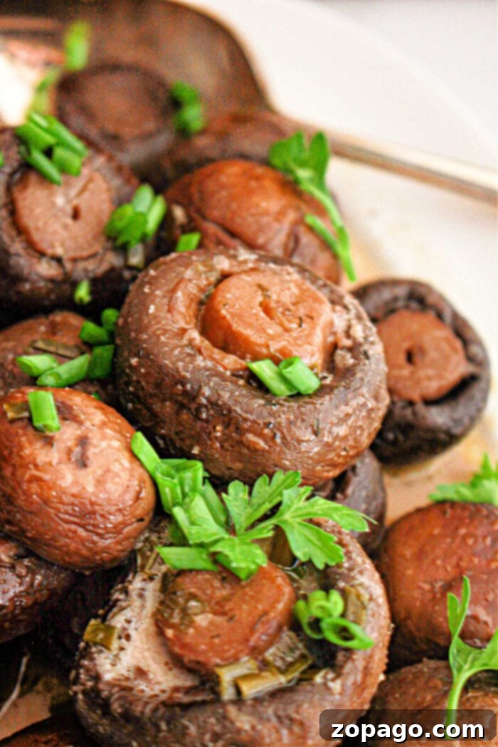 Simple Savory Crockpot Mushrooms 2 Flavorful baby bella mushrooms cooking slowly in a crockpot, promising a delicious side dish.