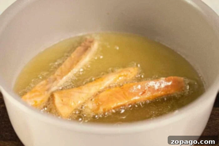 Golden Crispy Salmon 5 deep frying salmon on stove top