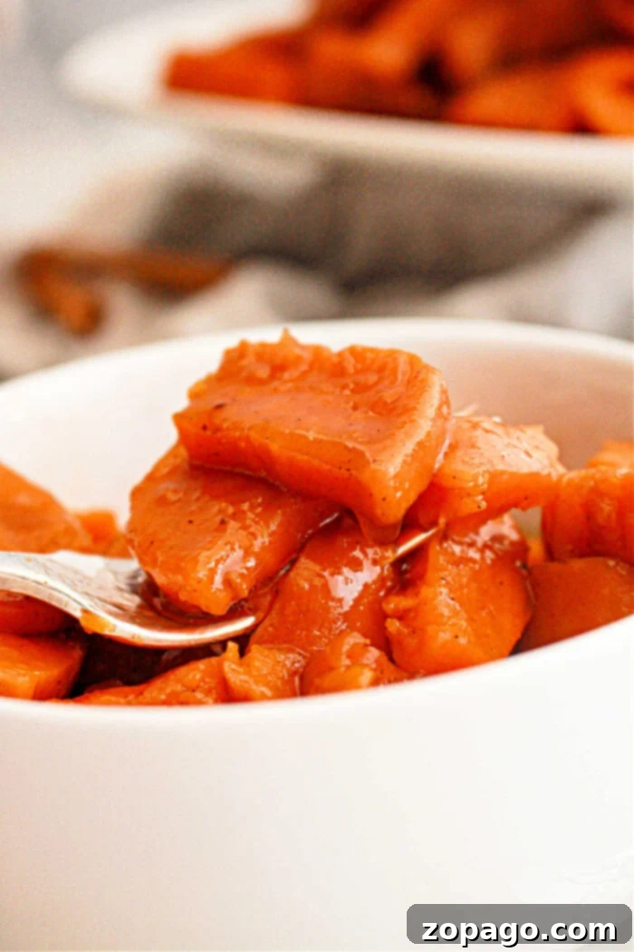 Crockpot Candied Yams 5 Homemade Candied Sweet Potatoes Recipe in a slow cooker, topped with melted marshmallows.