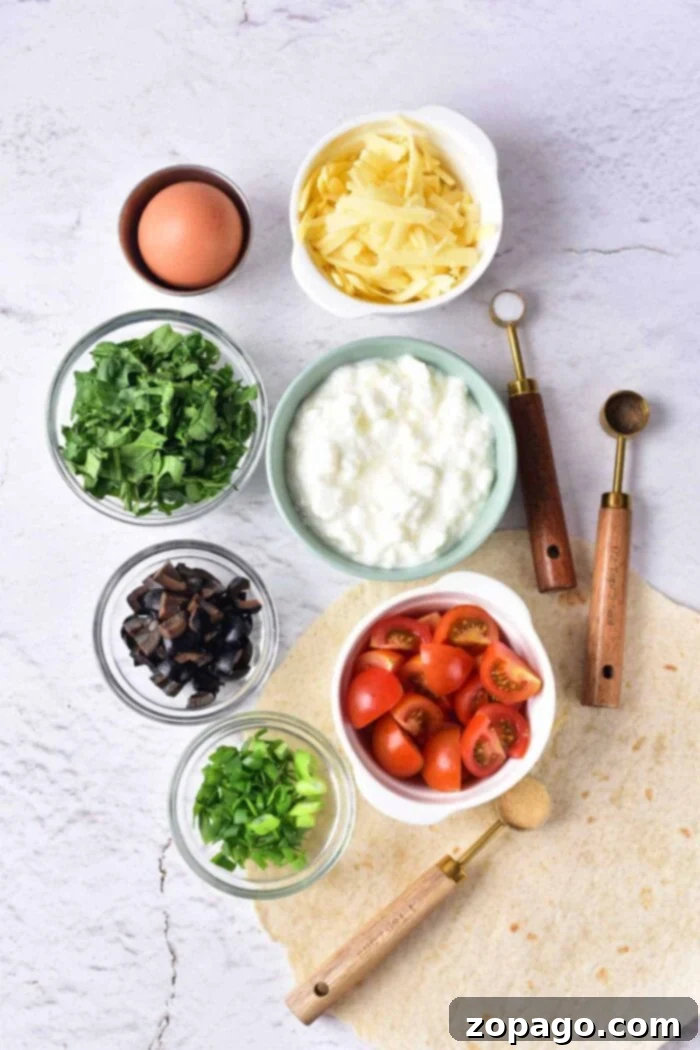 Wholesome Cottage Cheese Quiche 3 A flat lay image showcases various ingredients for a meal, perfect for making Cottage Cheese Quiche. These include grated cheese, an egg, chopped spinach, ricotta or cottage cheese, cherry tomatoes, chopped mushrooms, green onions, and a tortilla. Two wooden-handled scoops are placed nearby.