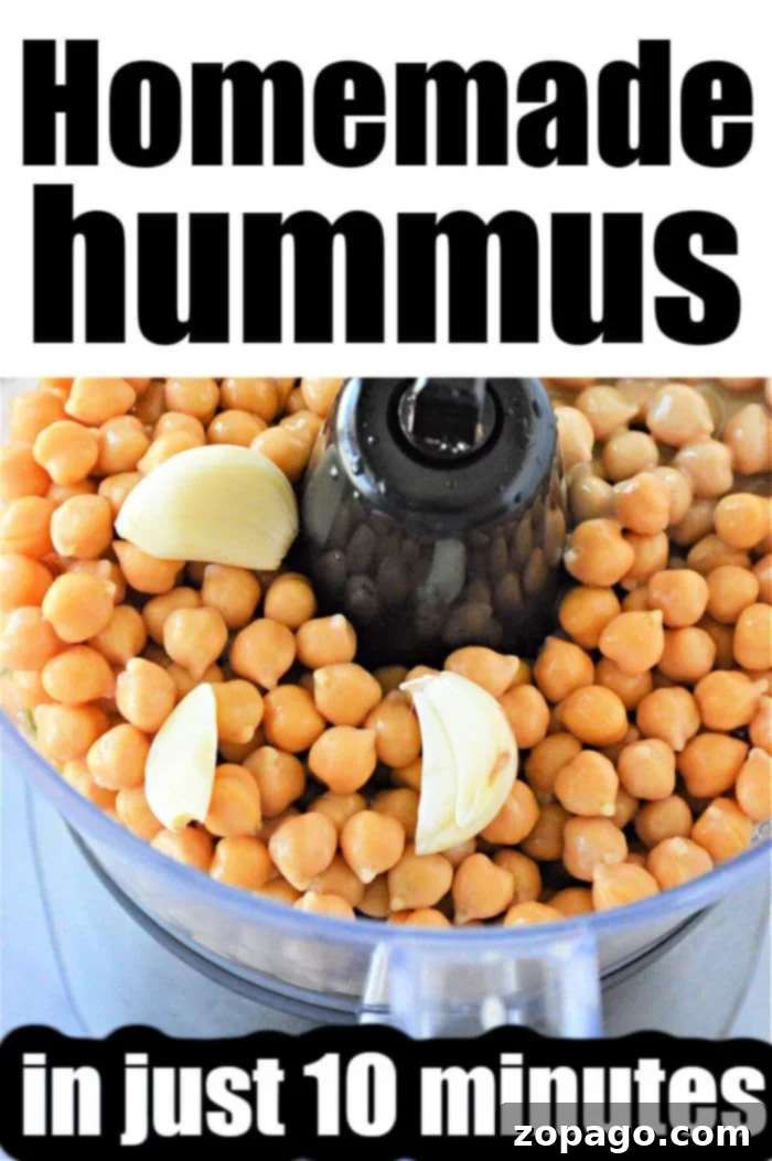 Effortless Hummus: Canned Chickpea Edition 4 A bowl of creamy, easy hummus with a drizzle of olive oil, perfect for dipping with fresh vegetables.