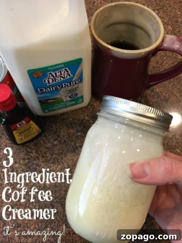 Homemade coffee creamer recipe requires just 3 ingredients and you can use any flavors you love! Cheap and simple way to jazz up your coffee. #coffee #creamer #homemade #simple #organic #easy #vanilla #pumpkin #coffeecreamer #dairyfree Homemade coffee creamer in a clear glass bottle, ready to be poured into a cup of coffee.
