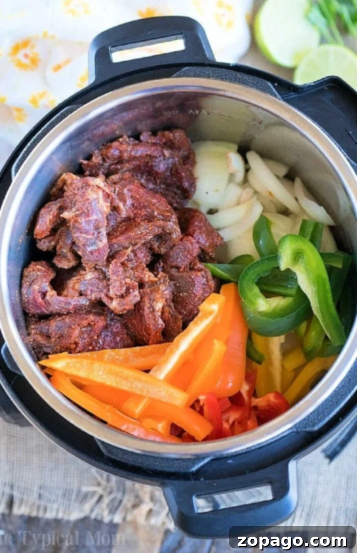 Instant Pot Your Weeknight Dinner Hero 2 Effortless weeknight dinners are just minutes away with this Instant Pot meal featuring seasoned meat, sliced onions, and a vibrant mix of green and red bell peppers ready for cooking.