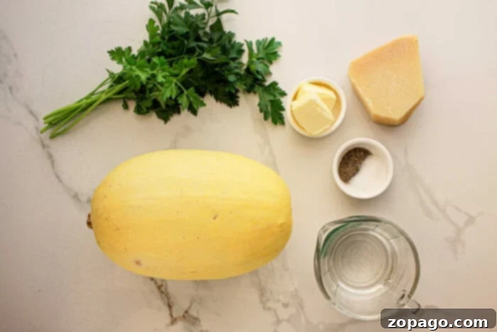 Effortless Slow Cooker Spaghetti Squash 3 Slow Cooker Spaghetti Squash, parsley, butter, Parmesan, salt, pepper, and water rest on a marble countertop.