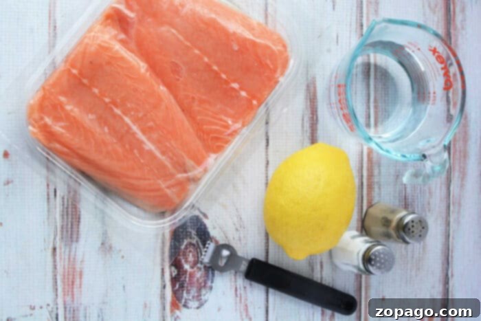 Quick Pressure Cooker Salmon 3 A delicious salmon recipe begins with raw fillets, a fresh lemon, and a measuring cup of water. Add salt and pepper for zest. Use a pressure cooker to infuse flavors effortlessly. Dont forget the black bottle opener nearby for your favorite refreshment.