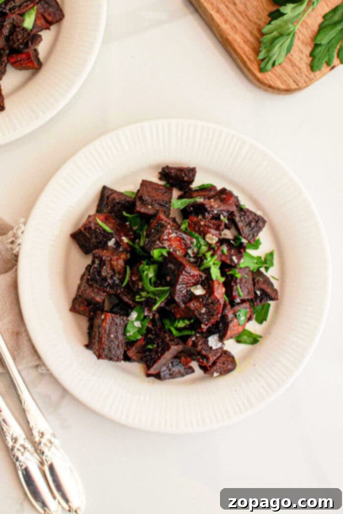 Vibrant Purple Sweet Potato Creations 6 A white plate filled with crispy purple sweet potato, ideal for those seeking an exciting new recipe twist.