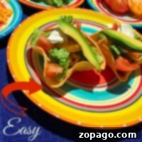 Colorful taco salad bowls filled with avocado, lettuce, and tomato slices sit on vibrant plates, labeled Easy Taco Cup Tutorial.