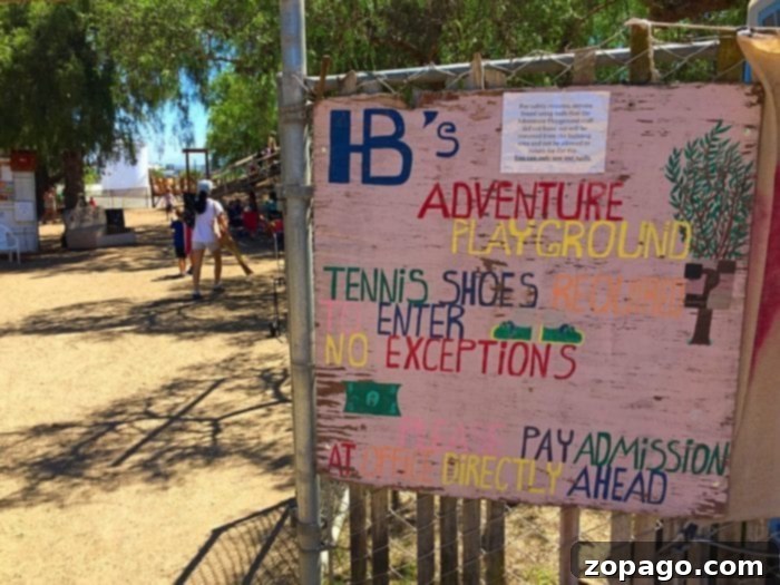Mud Play area and more at Huntington Beach Adventure Playground. Cheap things to do in Orange County with kids at Adventure Playground. Entrance path to the Huntington Beach mud park with a guiding arrow