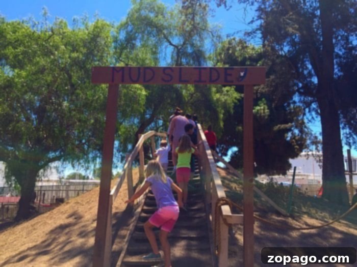 Surf City Adventure Playground 2 Children playing in a building area with wood and tools at Huntington Beach Adventure Playground